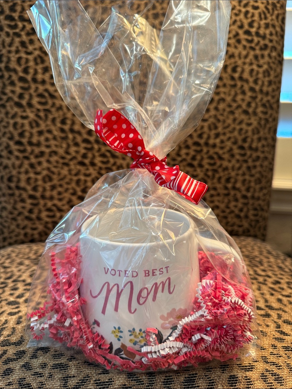Voted Best Mom White Ceramic Mug with Pink Lettering. Gift wrapping included.